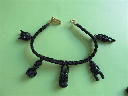 Tiki Idol Charm Bracelet Vintage Tropical Costume Jewelry Tribal Shrunken Head Charms