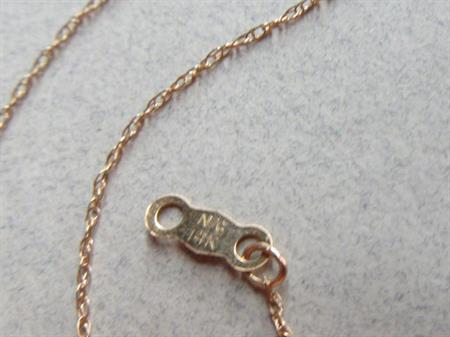 14k Gold Fine Chain Has Two Knots 0.5 Grams Fine Jewelry